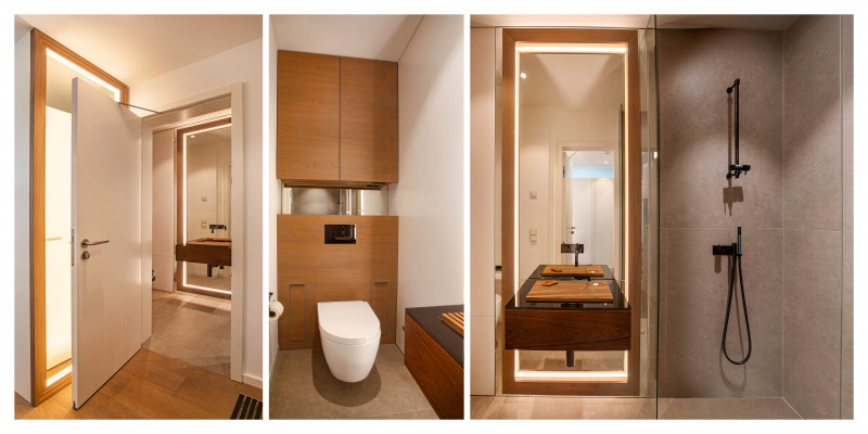 Kleines Bad mit begehbarer Dusche, beleuchtetem Spiegel moderner Toilette